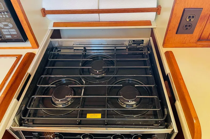 Slide: The Image of Three-burner stove in 2002 Island Packet 420 yacht kitchen. - 61