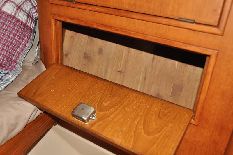 Slide: The Image of Wooden storage compartment on 2002 Island Packet 420 sailboat interior. - 68