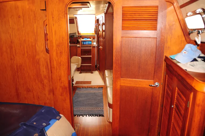 Slide: The Image of Interior of 2002 Island Packet 420 yacht with wooden cabinetry and cozy seating area. - 70