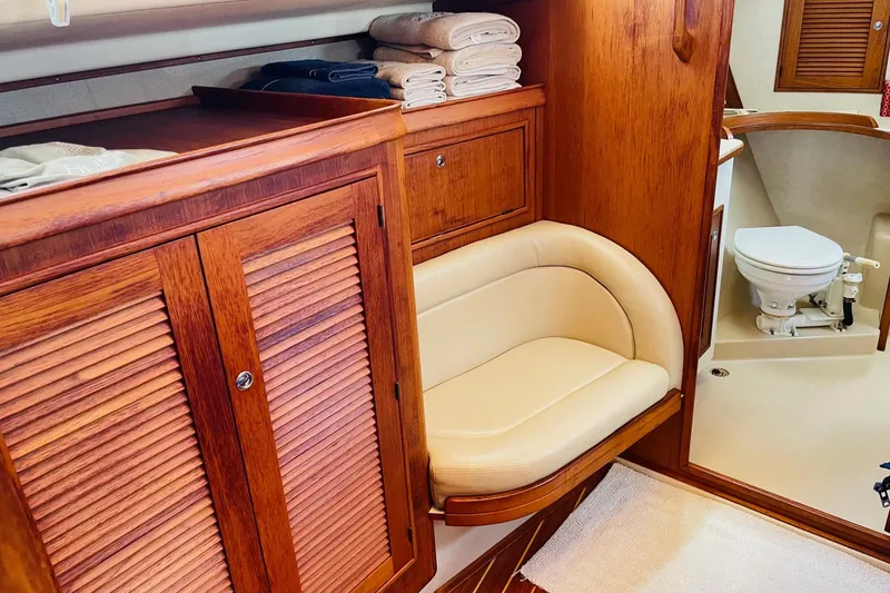 Slide: The Image of Luxurious 2002 Island Packet 420 yacht interior with wooden cabinetry and cozy seating. - 72
