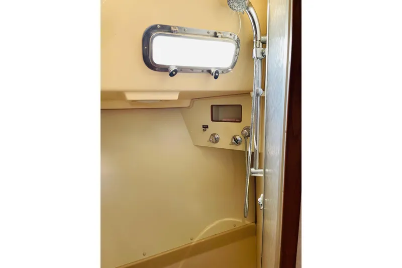 Slide: The Image of Shower area in 2002 Island Packet 420 yacht with window and controls. - 78