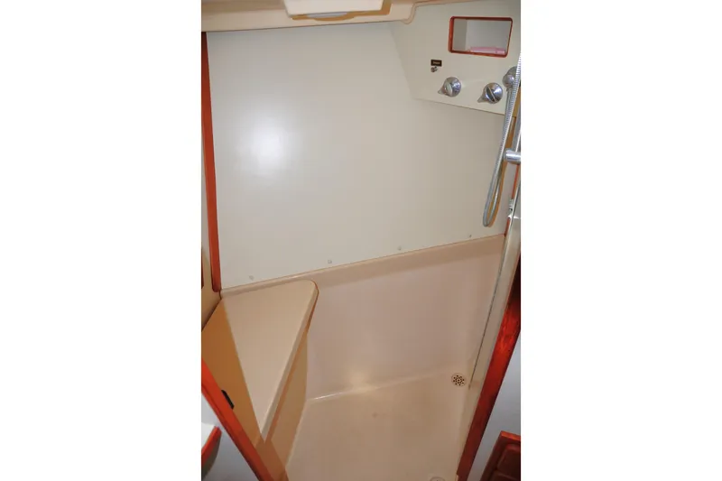 Slide: The Image of 2002 Island Packet 420 shower area with beige interior and chrome fixtures. - 80
