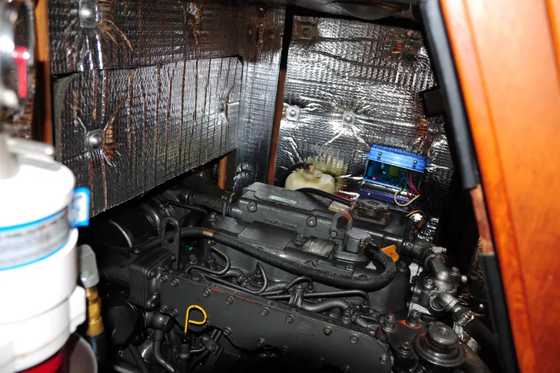 Slide: The Image of Engine compartment of a 2002 Island Packet 420 sailboat with insulation and components. - 90
