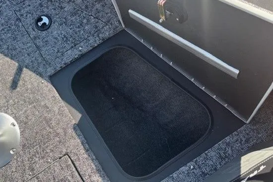 Slide: The Image of 2025 Tracker Targa V-19 WT Tournament Edition boat storage compartment, open and empty. - 10