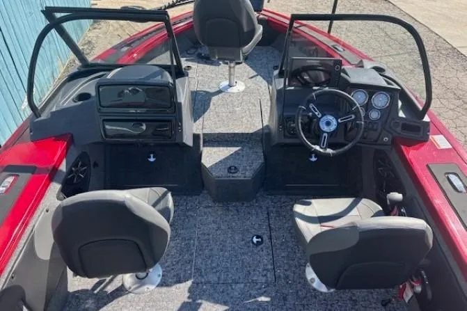 Slide: The Image of 2025 Tracker Targa V-19 WT Tournament Edition boat interior with steering wheel and seating. - 11