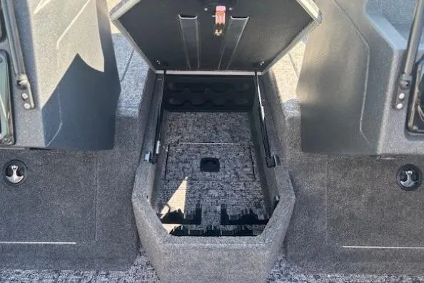 Slide: The Image of 2025 Tracker Targa V-19 WT Tournament Edition boat storage compartment open. - 12