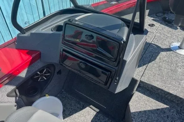 Slide: The Image of 2025 Tracker Targa V-19 WT Tournament Edition boat interior with modern dashboard and speaker system. - 13