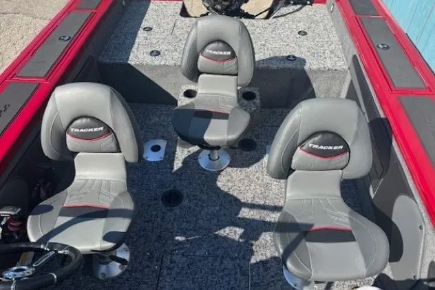 Slide: The Image of 2025 Tracker Targa V-19 WT Tournament Edition boat interior with three gray seats. - 17