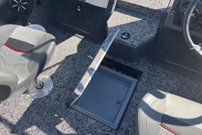 Slide: The Image of Interior of 2025 Tracker Targa V-19 WT boat with open storage compartment. - 18