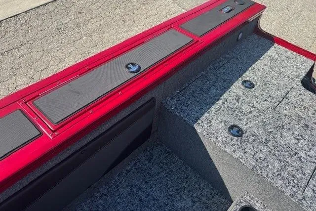 Slide: The Image of 2025 Tracker Targa V-19 WT Tournament Edition boat interior with red trim and gray carpet. - 23