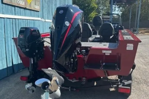 Slide: The Image of 2025 Tracker Targa V-19 WT Tournament Edition boat, rear view, parked outdoors. - 3