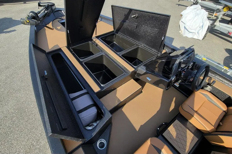 Slide: The Image of 2026 Xpress H20 Bass boat interior with storage compartments and steering console. - 3