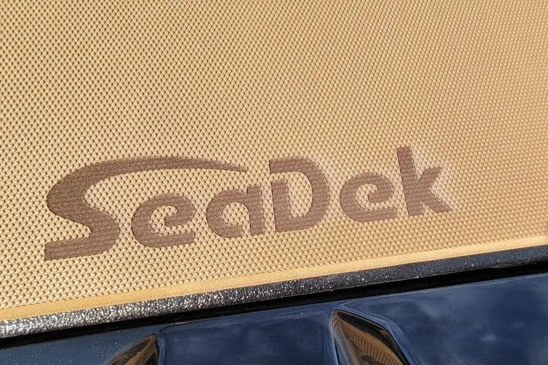Slide: The Image of SeaDek logo on 2026 Xpress H20 Bass boat deck, featuring textured surface. - 7