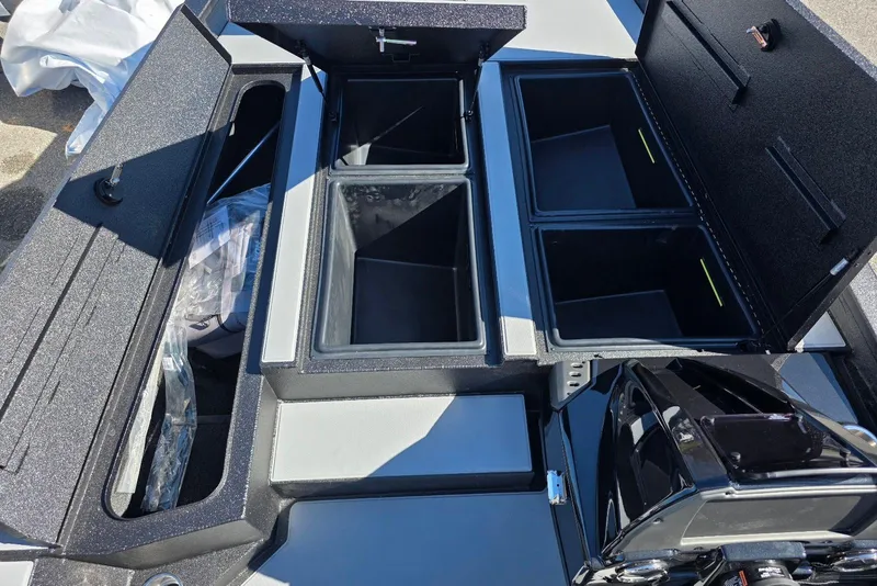 Slide: The Image of 2026 Xpress H20 Bass boat storage compartments and engine detail. - 10