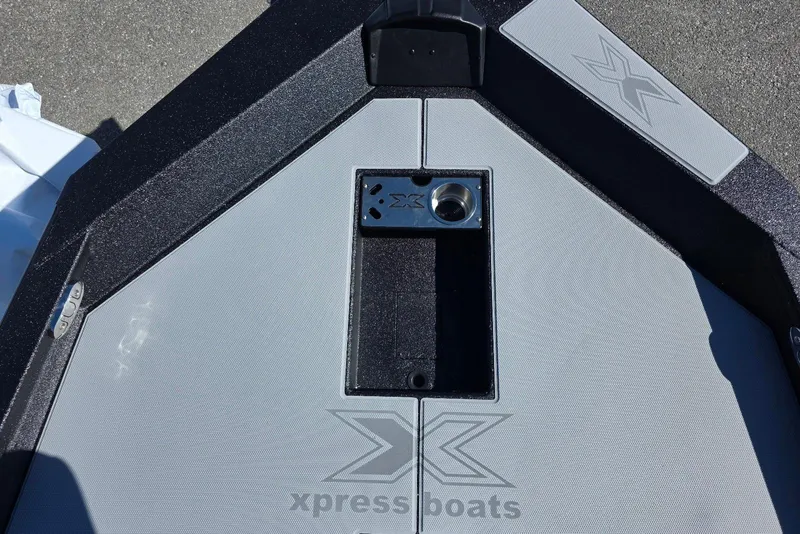 Slide: The Image of 2026 Xpress H20 Bass boat deck with logo and storage compartment. - 11