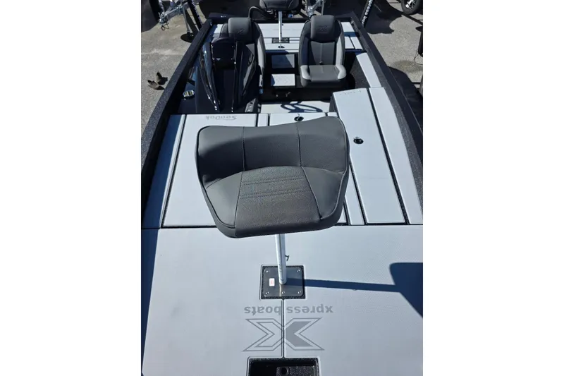 Slide: The Image of 2026 Xpress H20 Bass boat interior with seating and storage compartments. - 12