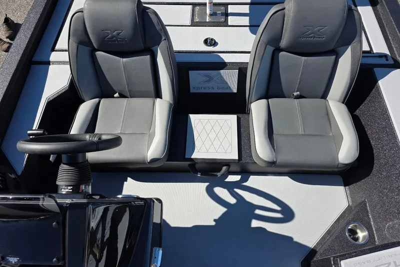 Slide: The Image of 2026 Xpress H20 Bass boat interior with dual gray seats and steering wheel. - 13