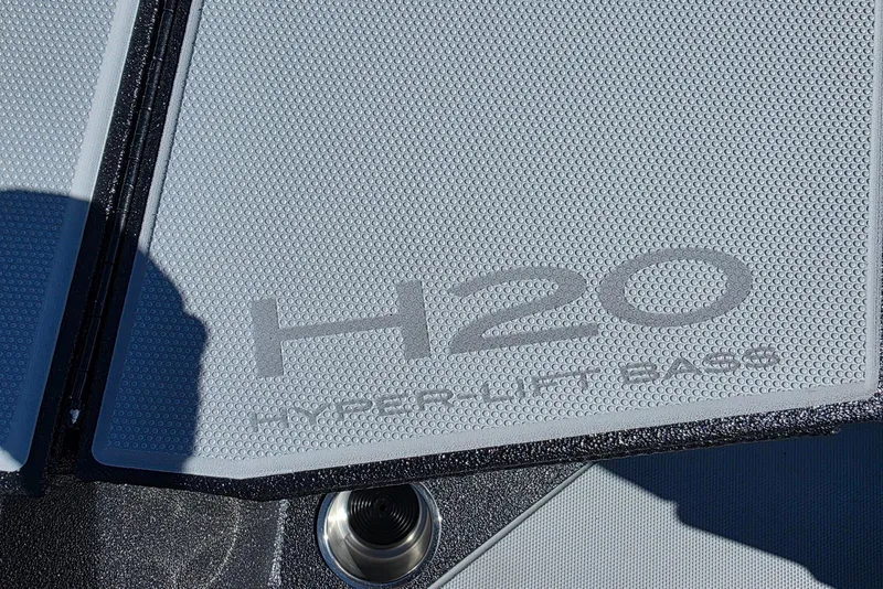 Slide: The Image of 2026 Xpress H20 Bass boat deck with textured surface and logo. - 15