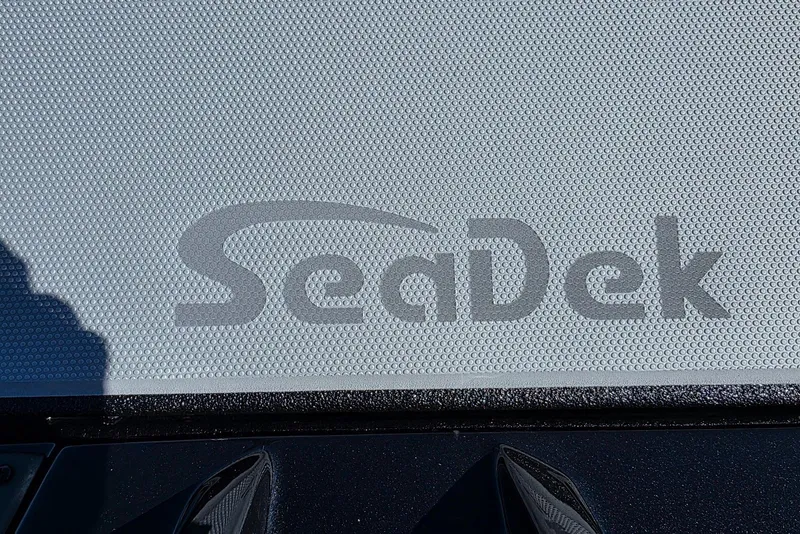 Slide: The Image of SeaDek logo on 2026 Xpress H20 Bass boat deck, textured surface. - 16