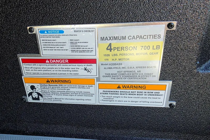 Slide: The Image of Safety and capacity labels on 2026 Xpress H20 Bass boat, detailing weight and passenger limits. - 19