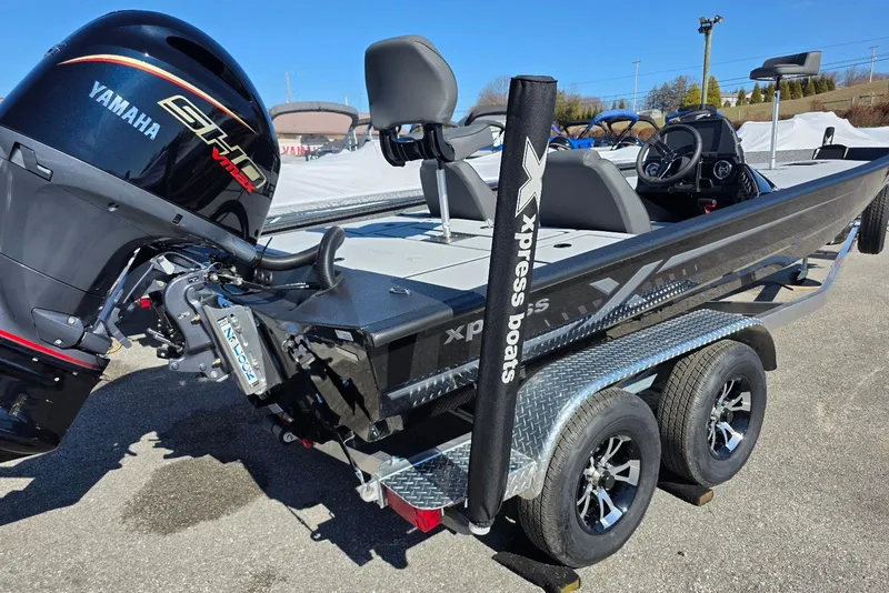 Slide: The Image of 2026 Xpress H20 Bass boat with Yamaha engine on trailer, outdoor display. - 5