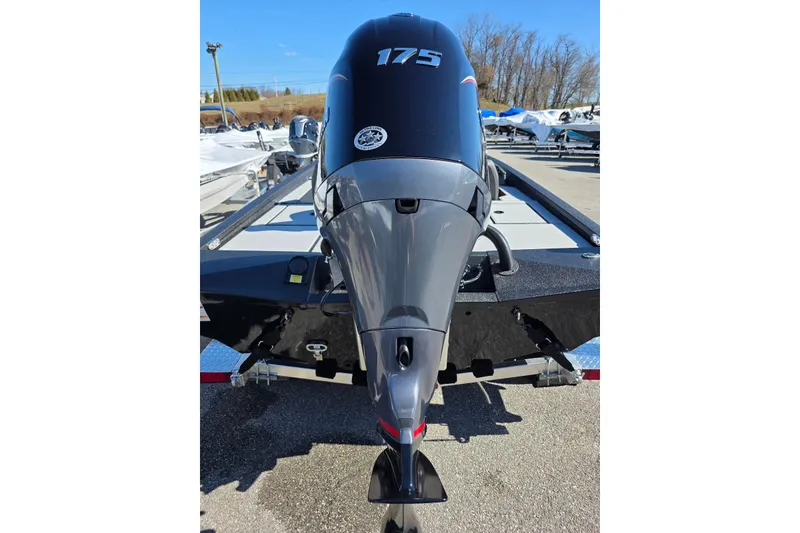 Slide: The Image of 2026 Xpress H20 Bass boat with powerful 175 horsepower engine, parked outdoors. - 7