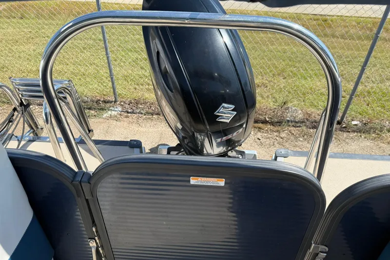 Slide: The Image of 2020 Manitou 21 Aurora LE with Suzuki outboard motor, rear view. - 10