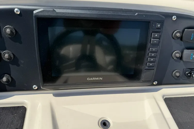 Slide: The Image of Dashboard of 2020 Manitou 21 Aurora LE with Garmin display and controls. - 8