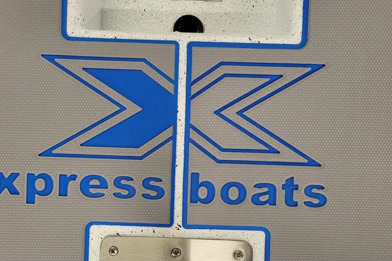 Slide: The Image of Xpress Boats logo on 2026 Xpress H20 Bass boat, featuring blue and gray design. - 7