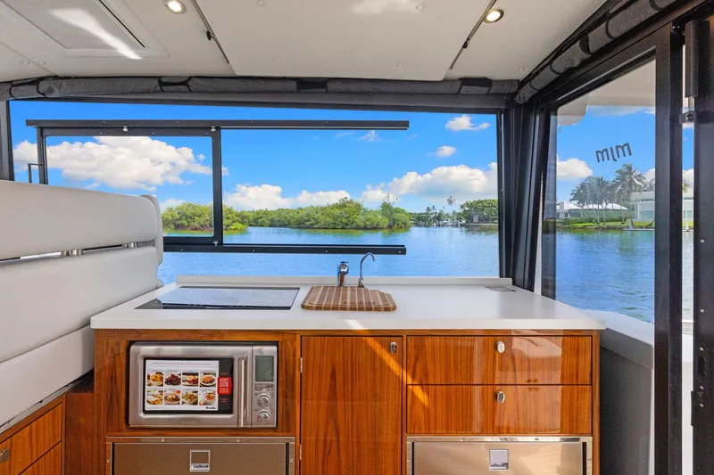 Slide: The Image of Luxurious 2024 MJM 42 yacht interior with modern kitchen and scenic water view. - 23
