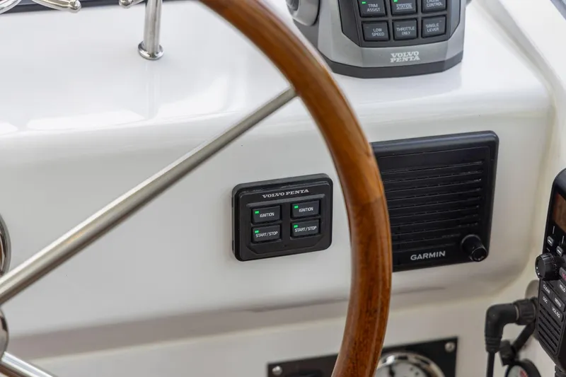 Slide: The Image of Helm of 2024 MJM 42 yacht featuring Volvo Penta controls and Garmin equipment. - 34