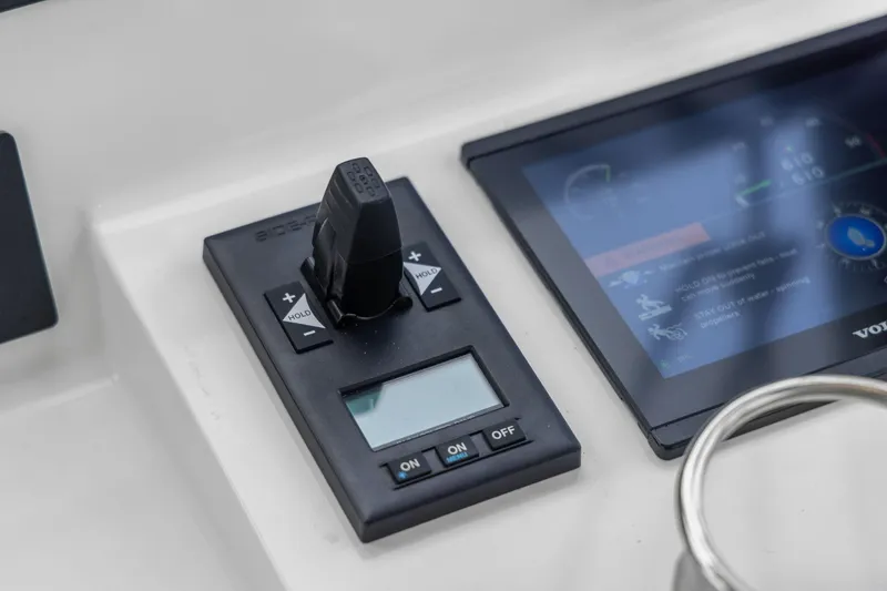 Slide: The Image of Control panel of 2024 MJM 42 boat with joystick and digital display. - 37
