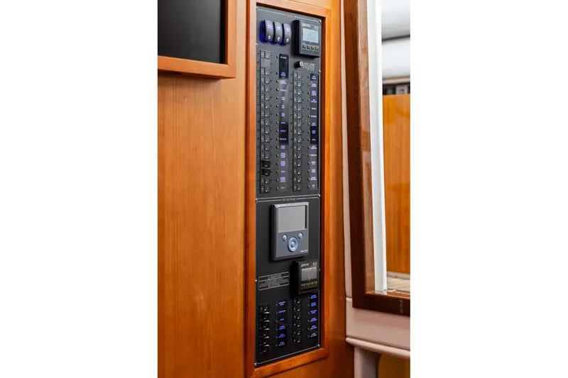 Slide: The Image of Electrical control panel on 2024 MJM 42 yacht, featuring switches and digital display. - 38