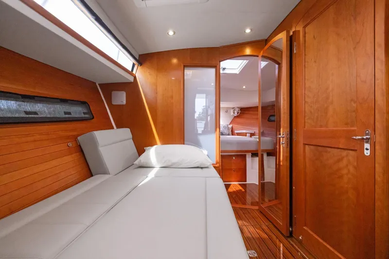 Slide: The Image of Luxurious interior of 2024 MJM 42 yacht with wooden finishes and comfortable seating. - 46