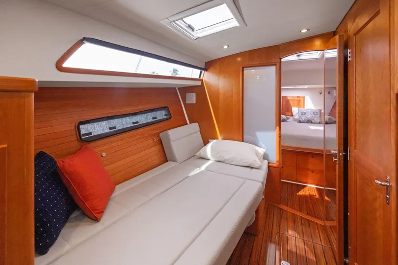 Slide: The Image of Luxurious interior of 2024 MJM 42 yacht with cozy seating and elegant wood finish. - 47