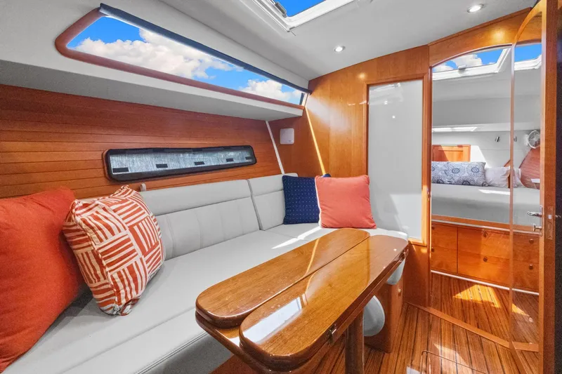 Slide: The Image of Luxurious interior of 2024 MJM 42 yacht with elegant wood finishes and plush seating. - 49