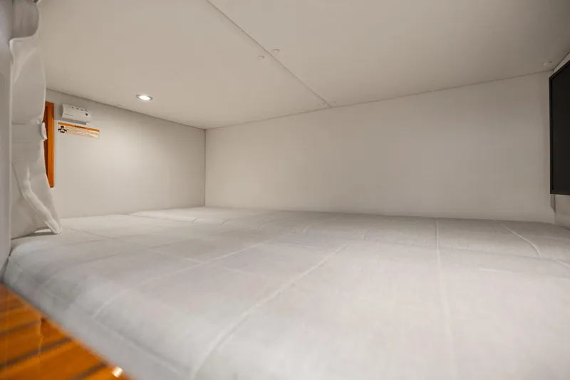 Slide: The Image of 2024 MJM 42 yacht interior cabin with cozy white bedding. - 53