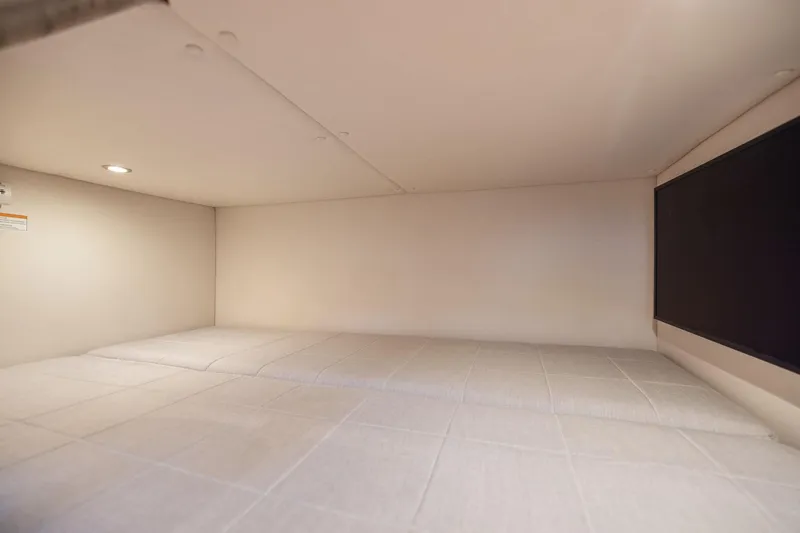 Slide: The Image of Interior cabin of 2024 MJM 42 yacht, featuring a cozy sleeping area. - 55