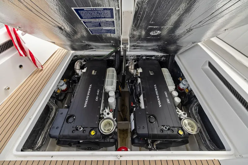 Slide: The Image of 2024 MJM 42 boat engine compartment with dual Volvo Penta D6-440 engines. - 57