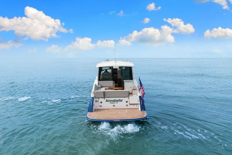 Slide: The Image of 2024 MJM 42 yacht cruising on open sea under blue sky. - 63