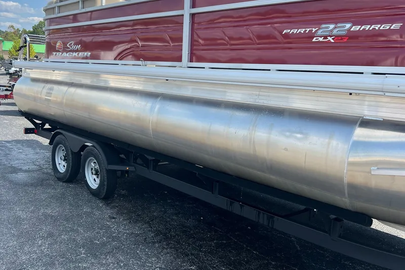 Slide: The Image of 2024 Sun Tracker Party Barge 22 RF XP3 pontoon boat on trailer, side view. - 3