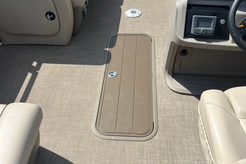 Slide: The Image of 2024 Sun Tracker Party Barge 22 RF XP3 interior with beige seating and flooring. - 4