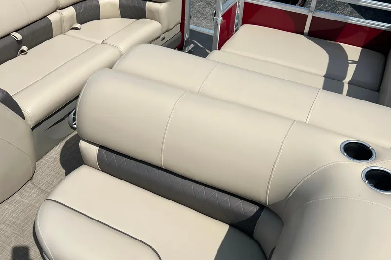 Slide: The Image of 2024 Sun Tracker Party Barge 22 RF XP3 interior with beige seating and cup holders. - 5