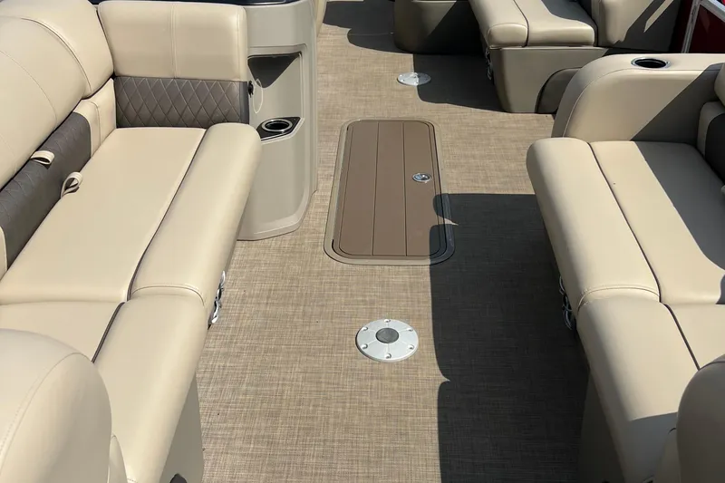 Slide: The Image of 2024 Sun Tracker Party Barge 22 RF XP3 interior with beige seating and flooring. - 6