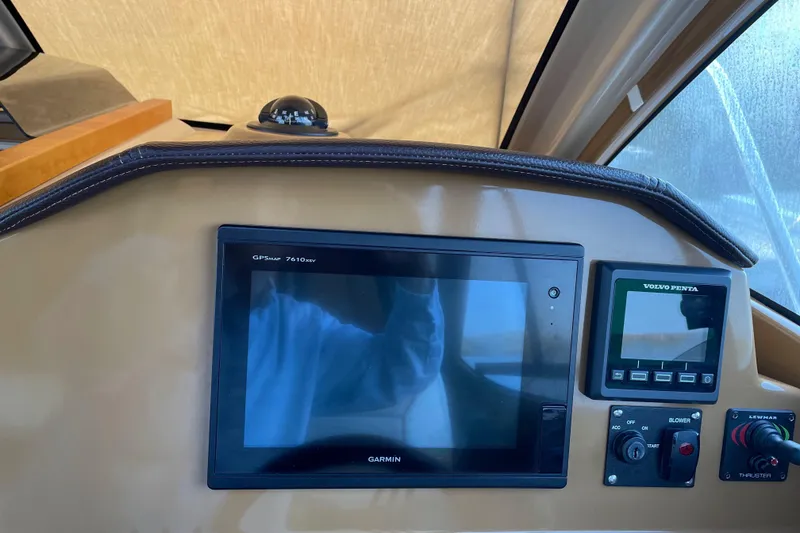 Slide: The Image of 2016 Cutwater C-24 Coupe dashboard with Garmin GPS and Volvo Penta display. - 17