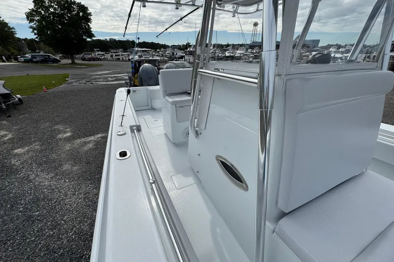 Slide: The Image of 2022 Contender 32 ST boat, sleek white interior, docked at marina. - 13
