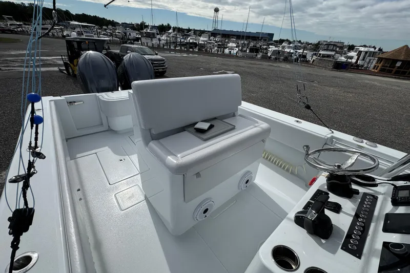 Slide: The Image of 2022 Contender 32 ST boat interior with dual engines at marina. - 14