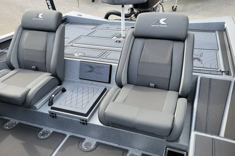 Slide: The Image of 2026 Xpress X19 Pro boat interior with two gray cushioned seats. - 3