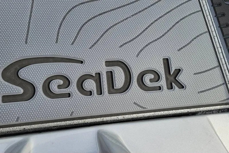 Slide: The Image of SeaDek logo on Xpress X19 Pro 2026 boat deck, featuring textured surface design. - 4