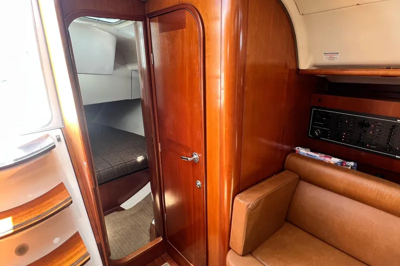 Slide: The Image of Interior of 1996 Beneteau Oceanis 400 sailboat with wood finish and cozy cabin. - 11